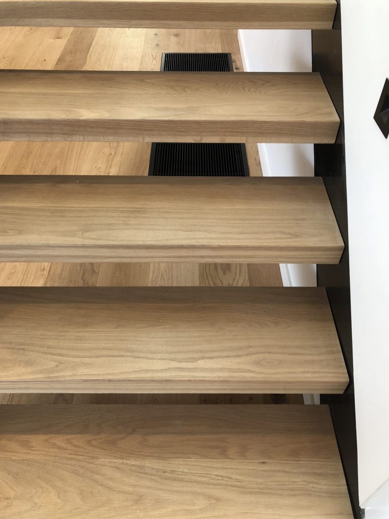 Daikin Ducted unit with Black floor return air grille stairs